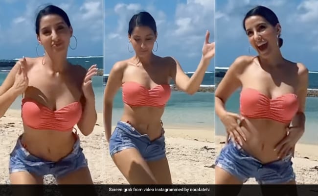 Bollywood Actress Nora Fatehi Heats Up The Beach In Red Bikini Bollywood Actress Nora Fatehi Heats Up The Beach In Red Bikini